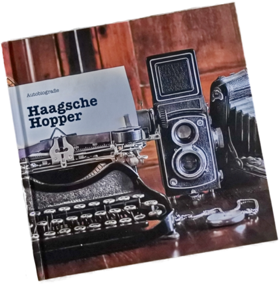 A book cover featuring a vintage typewriter, a twin-lens reflex camera, and an accordion camera on a wooden surface, with the title "Haagsche Hopper" visible.